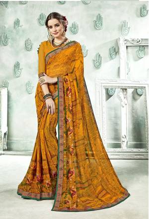 Traditional Color Is Here With This Saree In Musturd Yellow Color Paired With Musturd Yellow Colored Blouse. This Saree And Blouse Are Georgette Based Beautified With Prints And Lace Boder. 