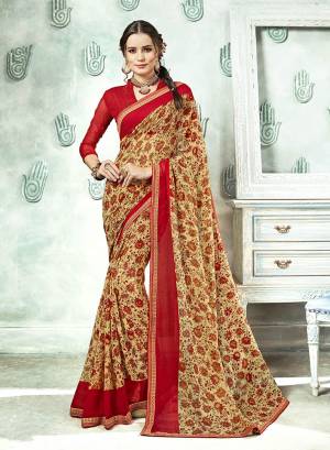 Traditional Color Is Here With This Saree In Cream Color Paired With Red Colored Blouse. This Saree And Blouse Are Georgette Based Beautified With Prints And Lace Boder. 
