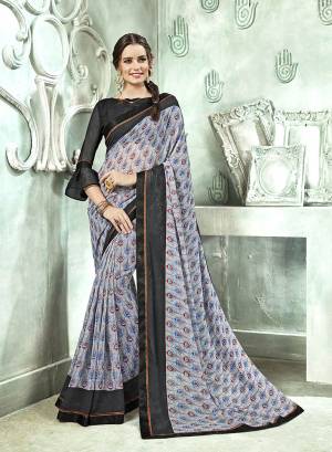 Add Some Casuals With This Saree In Grey Color Paired With Black Colored Blouse. This Saree And Blouse Are Georgette Based Beautified With prints All Over. Buy Now.