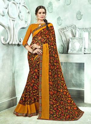 Simple Saree Is Here For Your Casual Wear In Brown Color Paired With Musturd Yellow Colored Blouse. This Saree And Blouse Are Fabricated On Georgette Beautified With Prints And lace Border. 