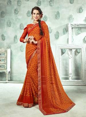 Traditional Color Is Here With This Saree In Orange And Yellow Color Paired With Orange Colored Blouse. This Saree And Blouse Are Georgette Based Beautified With Prints And Lace Boder. 