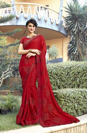 Adorn The Pretty Angelic Look Wearing This Designer Red Colored Saree Paired With Red Colored Blouse. This Saree Is Fabricated On Georgette Paired With Art silk Fabricated Blouse. It Has Very Pretty Tone To Tone Work embroidery All Over. 