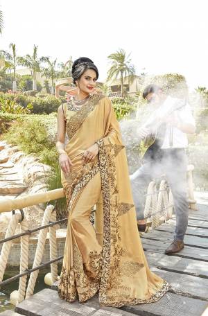 Simple And Elegant Looking Designer Saree Is Here In Beige Color Paired With Beige Colored Blouse. This Saree Is Fabricated On Georgette Paired With Art Silk Fabricated Blouse. It Is Beautified With Rich Embroidery Which Will Earn You Lots Of Compliments From Onlookers. 