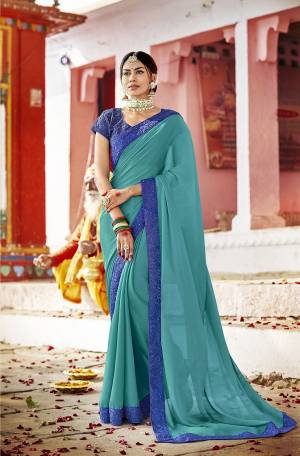 Here Is An Attractive Color Pallete With This Designer Saree In Sea Green Color Paired With Contrasting Royal Blue Colored Blouse. This Saree Is Georgette Based Paired With Art Silk Fabricated Blouse. It Is Light Weight And Durable Which Is Easy To Carry All Day Long.