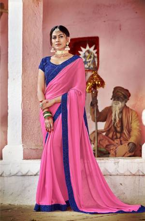 Look Pretty In This Pink Colored Saree Paired With Contrasting Royal Blue Colored Blouse. This Saree Is Georgette Based Paired With Art Silk Fabricated Blouse. Its Fabrics Ensures Superb Comfort All Day Long. Buy Now.