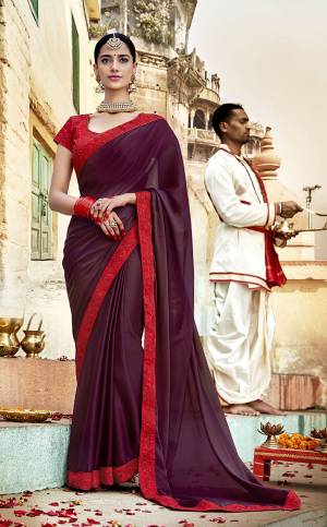 Look Pretty In This Wine Colored Saree Paired With Contrasting Red Colored Blouse. This Saree Is Georgette Based Paired With Art Silk Fabricated Blouse. Its Fabrics Ensures Superb Comfort All Day Long. Buy Now.