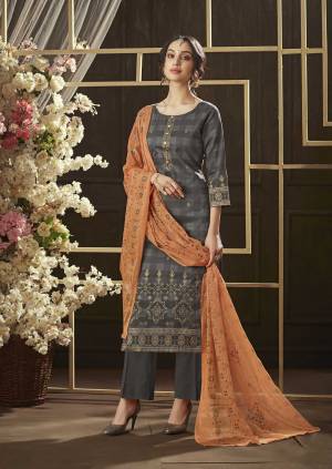 New And Unique Color Pallete Is Here With This Designer Dress Material In Grey Colored Top And Bottom Paired With Light Orange Colored Dupatta. Its Top And Bottom Are Fabricated On Cotton Paired With Chiffon Dupatta. Buy This Suit Now.
