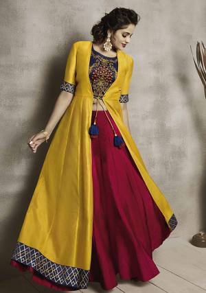 Go Colorful With This Lovely Designer Readymade Piece. Its Top Is In Navy Blue Color Paired With Contrasting Maroon Colored Bottom And Musturd Yellow Colored Jacket, Its Top And Bottom Are Silk Based Paired With Chanderi Based Jacket.