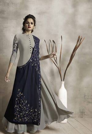 For A Proper Designer Look, Grab This Designer Readmade Gown In Grey Color Paired With A Beautiful Designer Jacket In Navy Blue Color. It Is Fabricated On Georgette Which IS Light In Weight And Comfortable To Carry All Day Long.