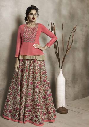 Another Very Pretty Pair Of Skirt And Top Is Here In Dark Peach Colored Top Paired With Light Olive Green colored Skirt. This Lovely Piece Is Chanderi Fabricated Beautified With Prints And Embroidery. 