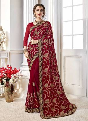 Adorn The Pretty Angelic Look Wearing This Heavy Designer Saree In Red Color Paired With Red Colored Blouse. This Saree Is Fabricated On Georgette Paired With Art Silk Fabricated Blouse. It Is Beautified With Heavy Embroidery All Over. 