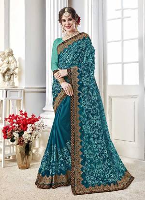 Celebrate This Festive Season Wearing This Pretty Blue Colored Saree Paired With Turquoise Blue Colored Blouse. This Saree Is Georgette Based Paired With Art Silk Fabricated Blouse. Buy Now.