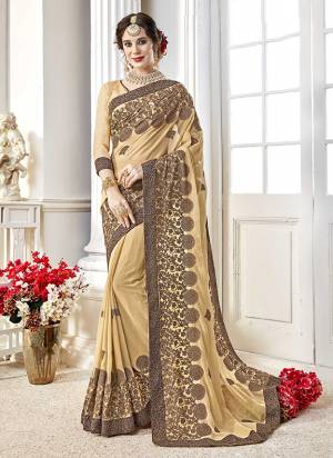 Simple, Rich And Elegant Looking Designer Saree Is Here In Beige Color Paired With Beige Colored Blouse. This Saree Is Georgette Based Paired With Art Silk Fabricated Blouse. It Is Durable And Easy To Drape. 