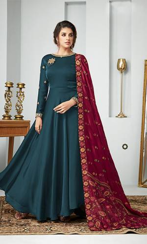 For A Bold And Beautiful Look, Grab This Designer Floor Length Suit In Blue Color paired with Maroon Colored Dupatta. Its Top Is Fabricated On Satin Georgette Paired With Santoon Bottom And Art Silk Dupatta. All Its Fabric Are Soft Towards Skin And Ensures Superb Comfort All Day Long. 