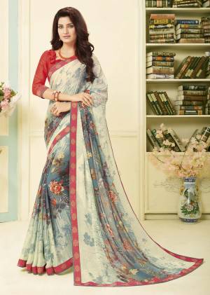 Grab This Pretty Saree For Your Casual Or Semi-Casual Wear. This Saree Is Fabricated On Georgette Paired With Satin Fabricated Blouse. It Is Beautified With Prints All Over. This Kurti Is Light Weight And Easy To Carry All Day Long. 