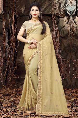 Simple And Elegant Looking Designer Saree Is Here In Light Yellow Color Paired With Sand Grey Colored Blouse. This Saree IS Fabricated On Linen Orgenza Paired With Art Silk Fabricated Blouse. Buy This Saree Now.