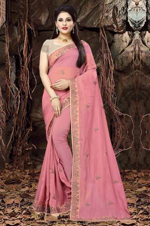 Shine Bright In This Designer Pink Colored Saree Paired With Sand Grey Colored Blouse. This Linen Orgenza Based Saree IS Light In Weight And Ensures Superb Comfort All Day Long. 