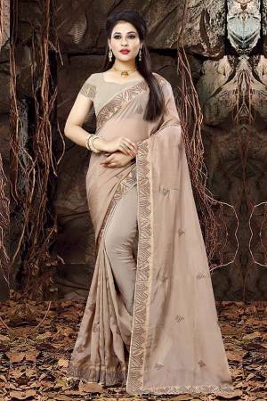 Flaunt Your Rich And Elegant Taste In This Designer Saree With Lovely Color Pallete, This Saree And Blouse Are In Sand Grey Color Fabricated On Linen Orgenza Paired With Art Silk Fabricated Blouse. Buy Now.