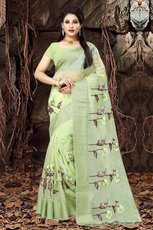 Add This Pretty Saree To Your Wardrobe In Light Green Color Paired With Light Green Colored Blouse. This Saree Is Orgenza Based Paired With Art Silk Fabricated Blouse. It Has Contrasting Thread Work Giving It An Attractive Look.