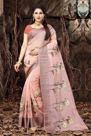 A Must Have Shade In Every Womens Wardrobe Is Here With This Designer Saree In Peach Color Paired With Dark Peach Colored Blouse. This Saree Is Orgenza Based Paired With Art Silk Fabricated Blouse. 