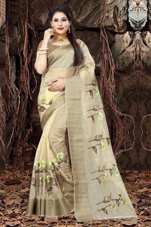 Simple And Elegant Looking Designer Saree Is Here In Light Yellow Color Paired With Brown Colored Blouse. This Saree IS Fabricated On Orgenza Paired With Art Silk Fabricated Blouse. Buy This Saree Now.