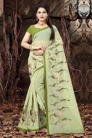 Add This Pretty Saree To Your Wardrobe In Light Green Color Paired With Green Colored Blouse. This Saree Is Orgenza Based Paired With Art Silk Fabricated Blouse. It Has Contrasting Thread Work Giving It An Attractive Look.