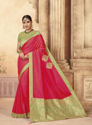 Shine Bright Wearing This Fuschia Pink Colored Saree Paired With Contrasting Light Green Colored Blouse. This Saree And Blouse Are Silk Based Beautified With Embroidery And Attractive Prints. 