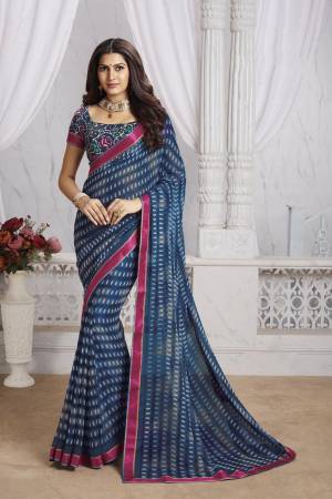 For Your Casual Or Semi-Casual Wear, Grab This Pretty Georgette Based Saree Beautified With Prints And Lace Border. Its Fabric Ensures Superb Comfort All Day Long And Also Durable. 