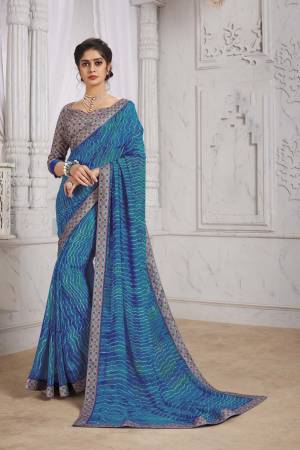 For Your Casual Or Semi-Casual Wear, Grab This Pretty Georgette Based Saree Beautified With Prints And Lace Border. Its Fabric Ensures Superb Comfort All Day Long And Also Durable. 