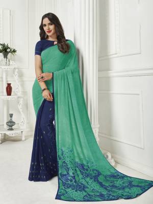 Here Is A Pretty Georgette Based Light Weight Saree For Your Casual Wear. This Saree Is Beautified With Floral Prints All Over And Also It Is Easy To Carry All Day Long. 