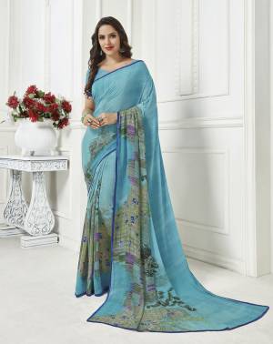 Here Is A Pretty Georgette Based Light Weight Saree For Your Casual Wear. This Saree Is Beautified With Floral Prints All Over And Also It Is Easy To Carry All Day Long. 