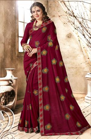 Here Is A Beautiful Designer Royak Looking Saree In Maroon Color Paired With Maroon Colored Blouse. This Saree Is Fabricated On Georgette Paired With Art Silk Fabricated Blouse. It Is Beautified With Multi Colored Thread Work Giving It An Attractive Look.