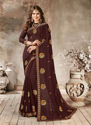 Here Is A Beautiful Designer Royak Looking Saree In Brown Color Paired With Brown Colored Blouse. This Saree Is Fabricated On Georgette Paired With Art Silk Fabricated Blouse. It Is Beautified With Multi Colored Thread Work Giving It An Attractive Look.