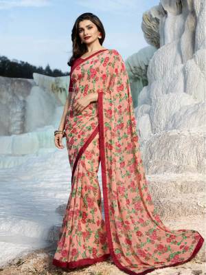Look Pretty In this Light Pink Colored Saree Paired With Dark Pink Colored Blouse. This Saree Is Georgette Based Paired With Art Silk Fabricated Blouse. It Is Beautified With Floral Prints All Over. 