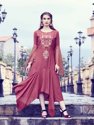 You Will Earn Lots Of Compliments Wearing This Designer Readymade Kurti In Maroon Color Fabricated On Soft Fluid Silk Fabric. It Is Available In All Regular Sizes. Buy Now.