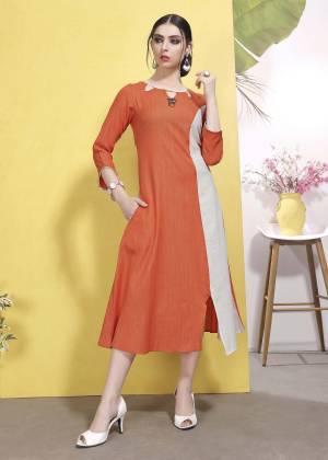 For Your Casual Or Semi-Casual Wear, Grab This Designer Readymade Kurti In Orange And White Color Which Is Cotton based. This Kurti Is Available In All Regular Sizes. 
