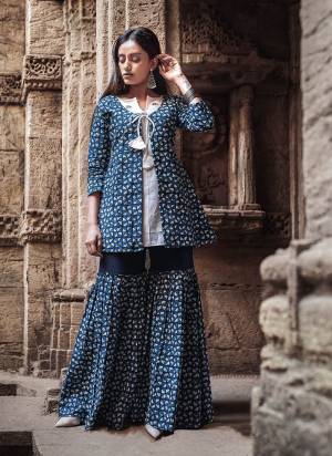 Here Is A Beautiful Designer Indo Western Pair Of Sharara Set In Blue Color. This Lovely Set Is Cambric Cotton Based Beautified With Prints All Over. It Is Available In All Regular Sizes. 