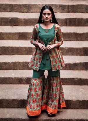 You Will Definitely Earn Lots Of Compliments Wearing This Designer Readymade Sharara Set In Shades Of Green. Its Top And Bottom Are Fabricated On Cambric Cotton Beautified With Prints All Over. Buy Now.