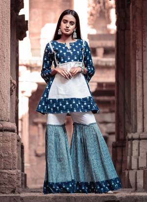 Here Is A Beautiful Designer Indo Western Pair Of Sharara Set In Blue Color. This Lovely Set Is Cambric Cotton Based Beautified With Prints All Over. It Is Available In All Regular Sizes. 