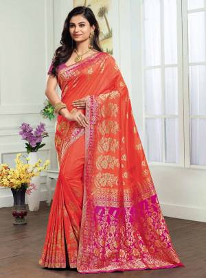 Shine Bright In this Attractive Looking Orange Colored Saree Paired With Contrasting Rani Pink Colored Blouse. This Saree And Blouse Are Fabricated On Kanjivaram Art Silk Beautified With Weave. 