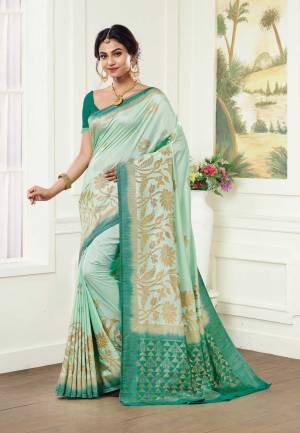 This Season Is About Subtle Shades And Pastel Play, So Grab This Pretty Silk Based Saree In Pastel Green Color Paired With Sea Green Colored Blouse. This Saree And Blouse Are Fabricated On Kanjivaram Art Silk Which Gives A Rich Look To Your Personality. 