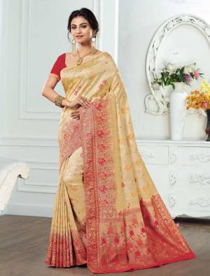 Celebrate This Festive Season Wearing This Designer Silk Based Saree In Light Yellow Color Paired With Contrasting Red Colored Blouse. This Saree And Blouse Are Fabricated On Kanjivaram Art Silk Beautified With Weave All Over It. 