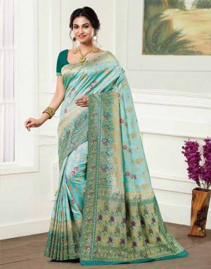 Look Pretty Wearing This Designer Silk Based Saree In Sky Blue Color Paired With Sea Green Colored Blouse. This Saree And Blouse Are Fabricated On Kanjivaram Art Silk Beautified With Weave All Over. 