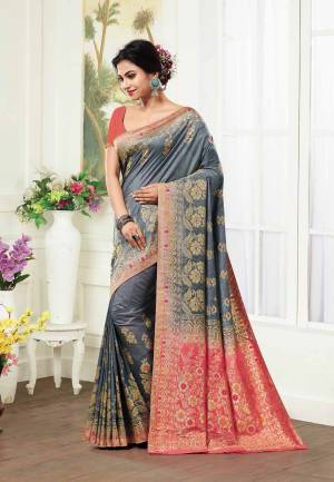 Flaunt Your Rich And Elegant Taste With This Rich Color Pallete In Silk Based Grey Colored Saree Paired With Contrasting Peach Colored Blouse. This Saree And Blouse Are Fabricated On Kanjivaram Art Silk Beautified With Weave All Over. 