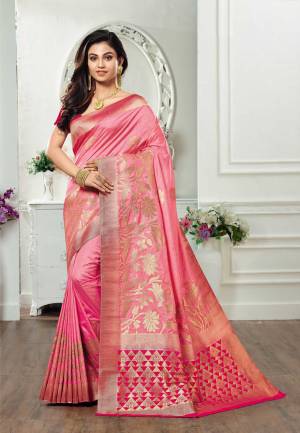 Get Ready For The Upcoming Festive And Wedding Season Wearing This Silk Based Saree In Pink Color Paired With Dark Pink Colored Blouse. This Saree And Blouse Are Fabricated On Kanjivaram Art Silk Beautified With Weave All Over. 