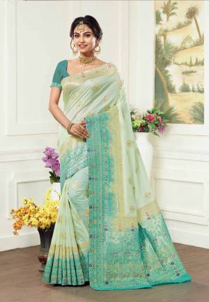 This Season Is About Subtle Shades And Pastel Play, So Grab This Pretty Silk Based Saree In Pastel Green Color Paired With Sea Green Colored Blouse. This Saree And Blouse Are Fabricated On Kanjivaram Art Silk Which Gives A Rich Look To Your Personality. 