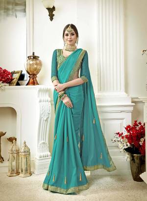 Grab This Very Pretty Designer Saree In Turquoise Blue Color Paired With Turquoise Blue Colored Blouse. This Saree Is Georgette Based Paired With Art Silk Fabricated Blouse. 