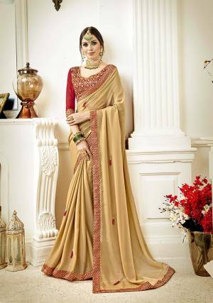 Flaunt Your Rich And Elegant Taste With This Royal Color Pallete Designer Saree. This Saree Is In Beige Color Paired With Red Colored Blouse. This Saree Is Fabricated On Georgette Paired With Art Silk Fabricated Blouse. 