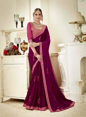 Look Pretty Wearing This Designer Saree In Magenta Pink Color Paired With Light Pink Colored Blouse. This Saree Is Fabricated On Georgette Paired With Art Silk Fabricated Blouse. Its Attractive Part Is The Tassels Over The Saree. 