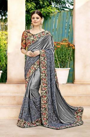 New And Unique Color Pallete Is Here With This Designer Saree In Grey Color Paired With Beige Colored Blouse. This Saree Is Fabricated On Lycra And Net Paired With Art Silk Fabricated Blouse. 